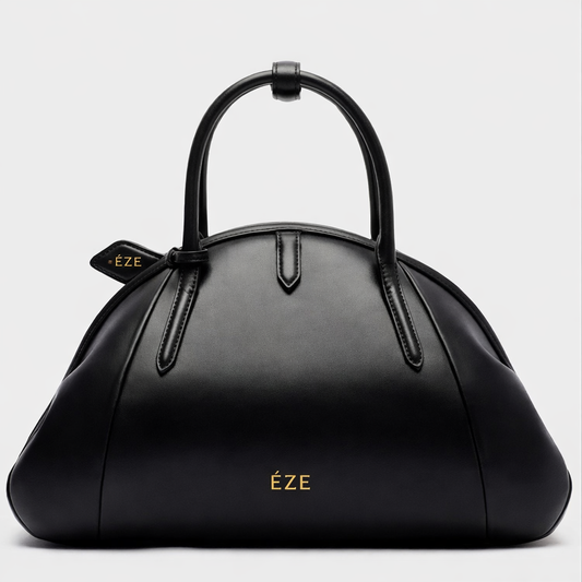 ÉZE — Bolso “Noir Arc” Volumen escultural. Elegancia en movimiento.